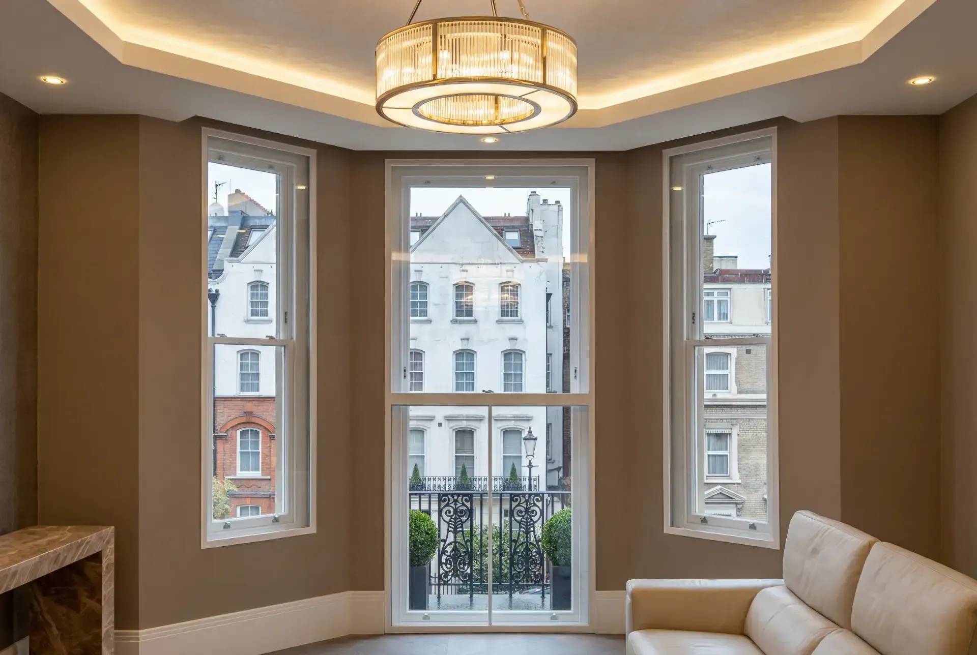 Tall sash windows and a balcony door fitted with slimline secondary glazing in a Marylebone apartment