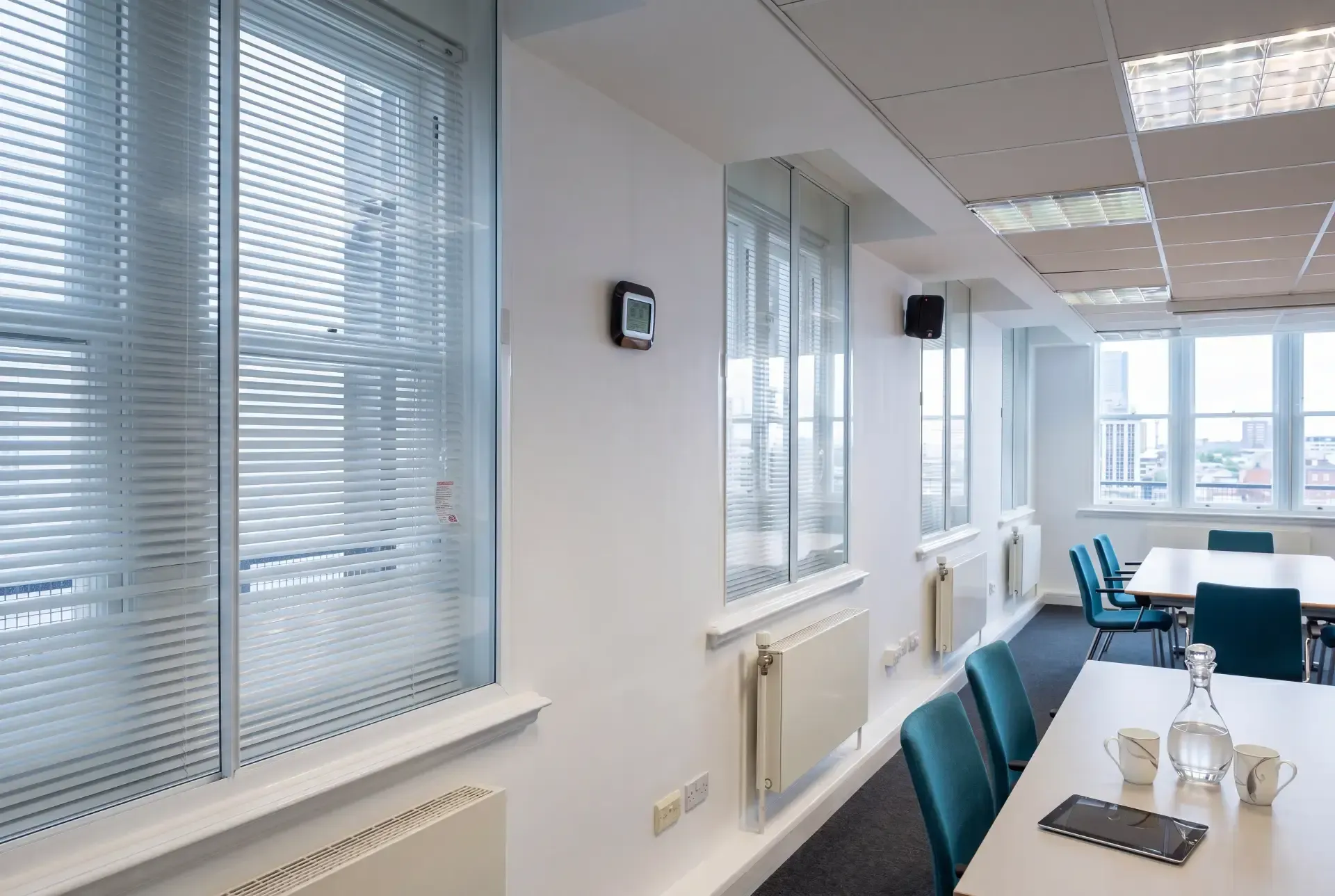 Office windows with integral blinds fitted with secondary glazing for noise and thermal control