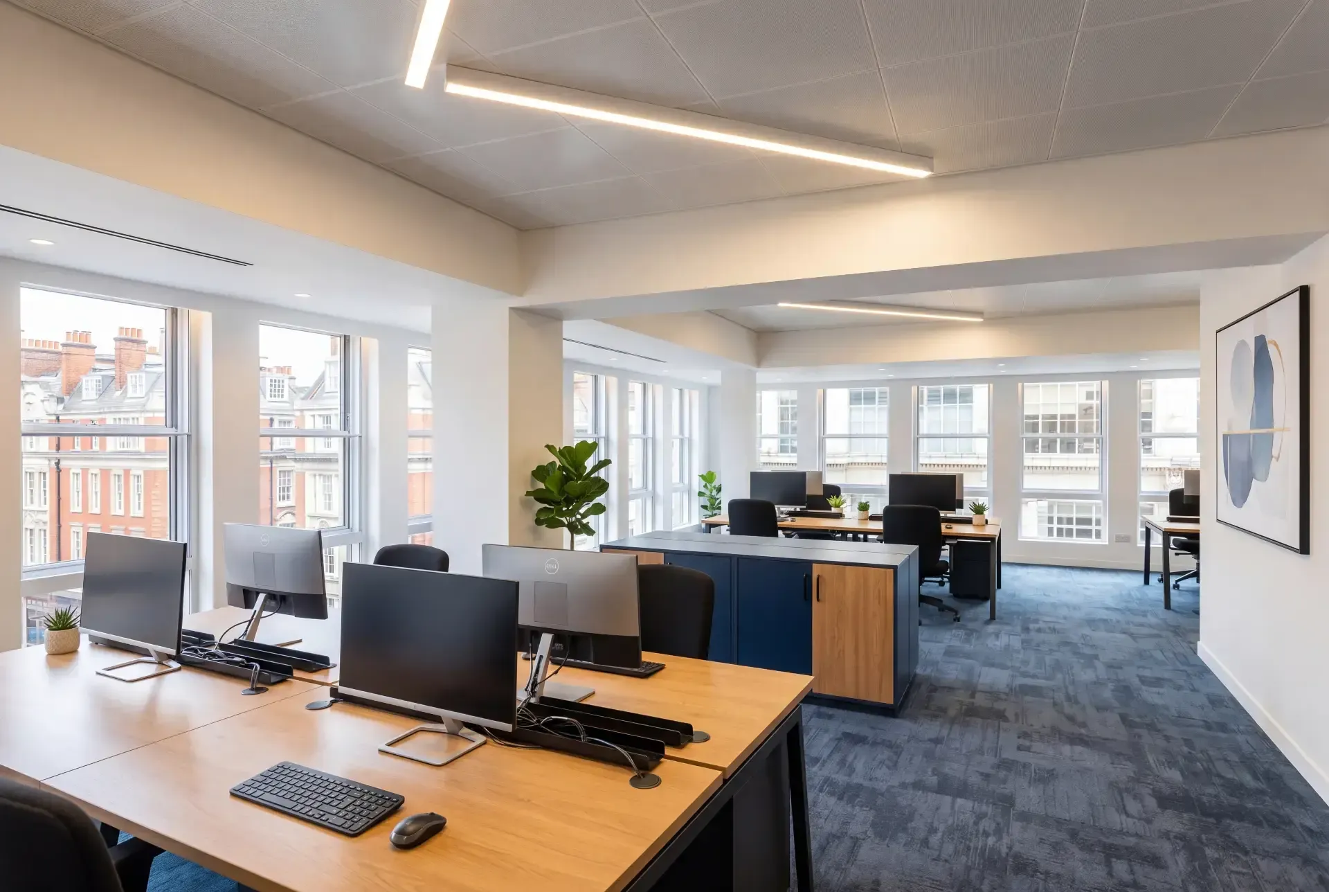 Open-plan office floor with a full run of windows fitted with slimline secondary glazing